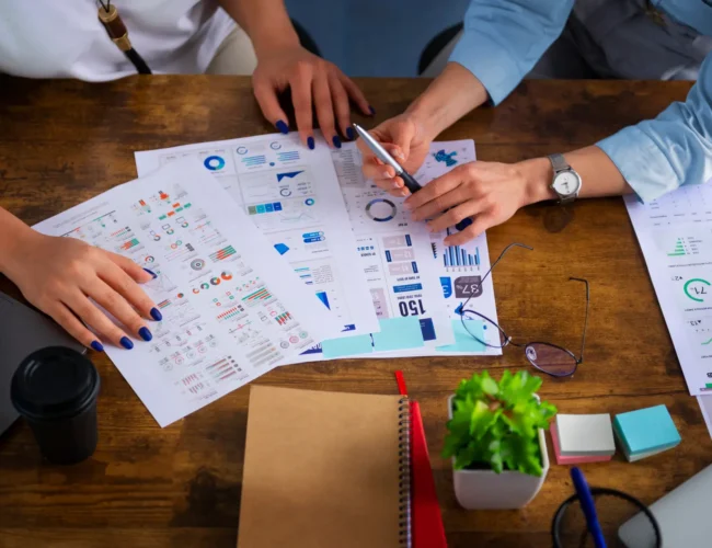 high-angle-women-working-together-office